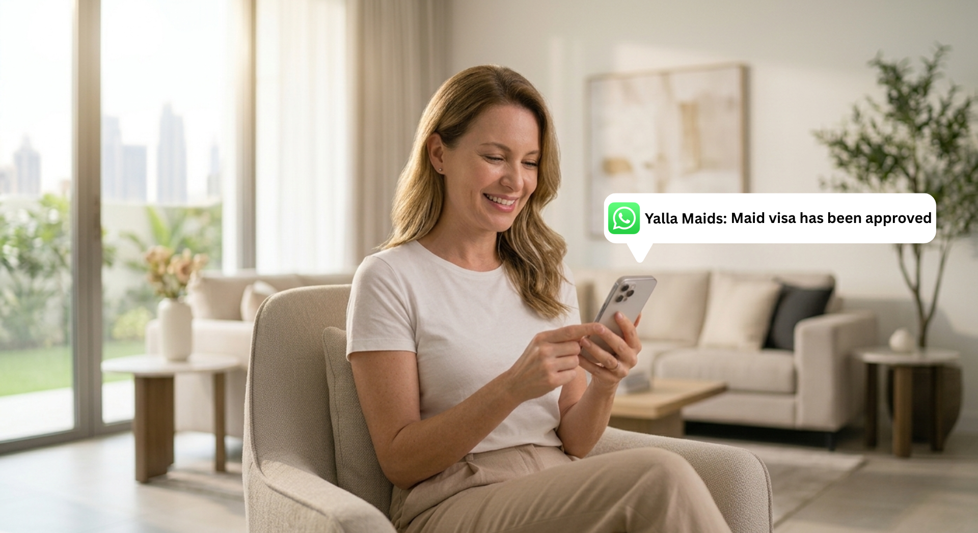Woman using her phone after her maid visa approval.
