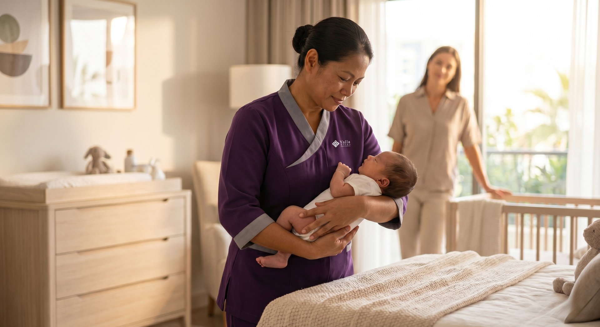 Hire a nanny in Dubai caring for a newborn while a parent observes in a bright nursery.