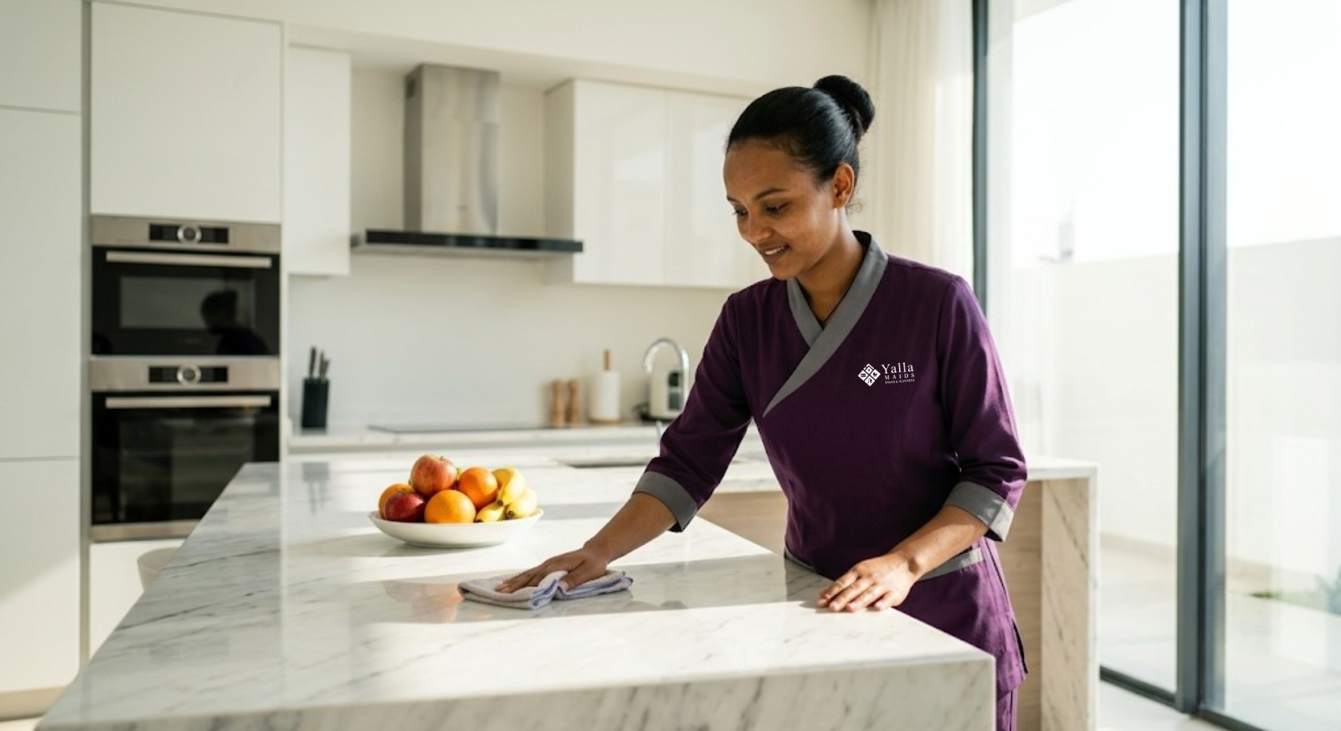 Ethiopian maid in Dubai cleaning a modern kitchen.